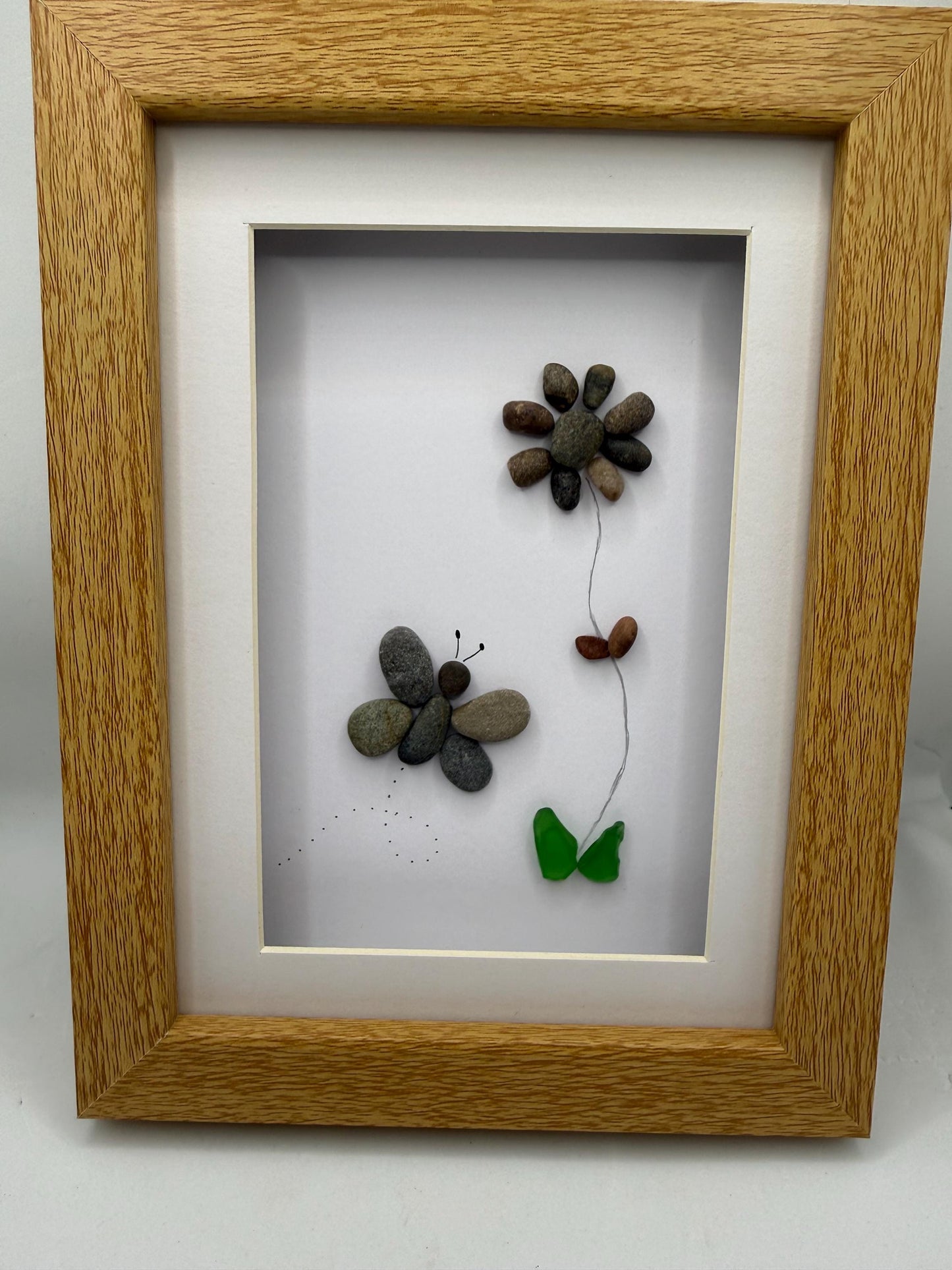 Butterfly and flower pebble art, pebble art, pebble art flower, sea glass, butterfly pebble art