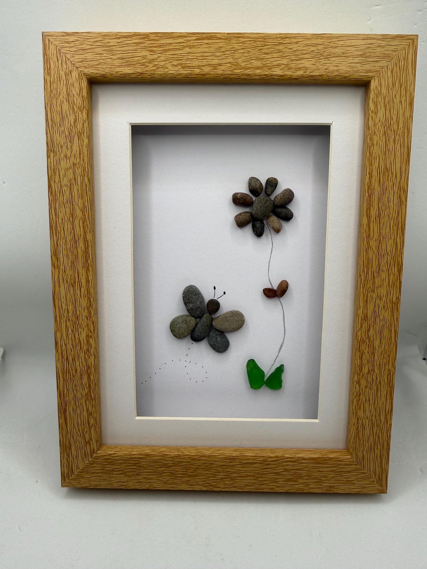 Butterfly and flower pebble art, pebble art, pebble art flower, sea glass, butterfly pebble art