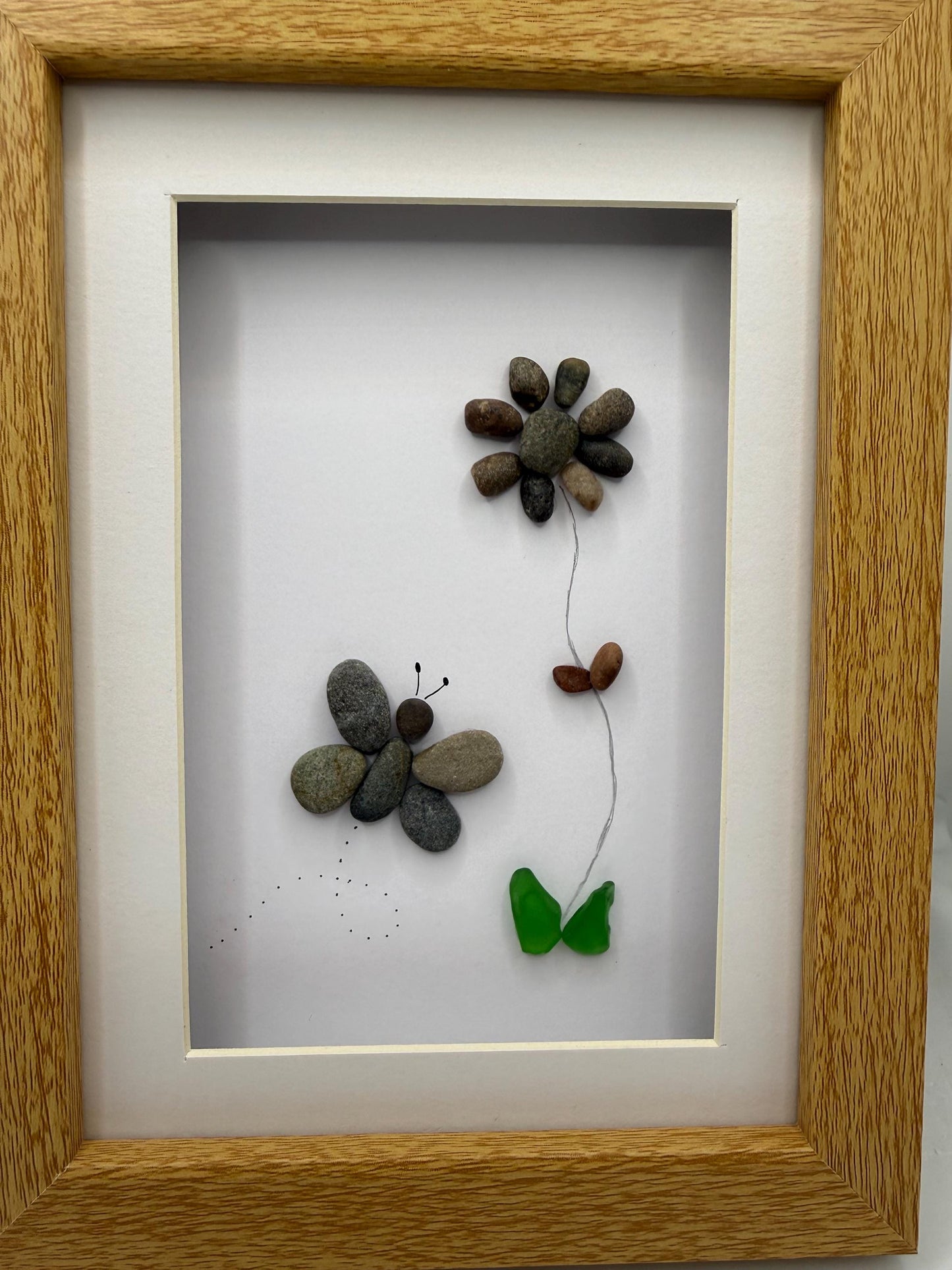 Butterfly and flower pebble art, pebble art, pebble art flower, sea glass, butterfly pebble art